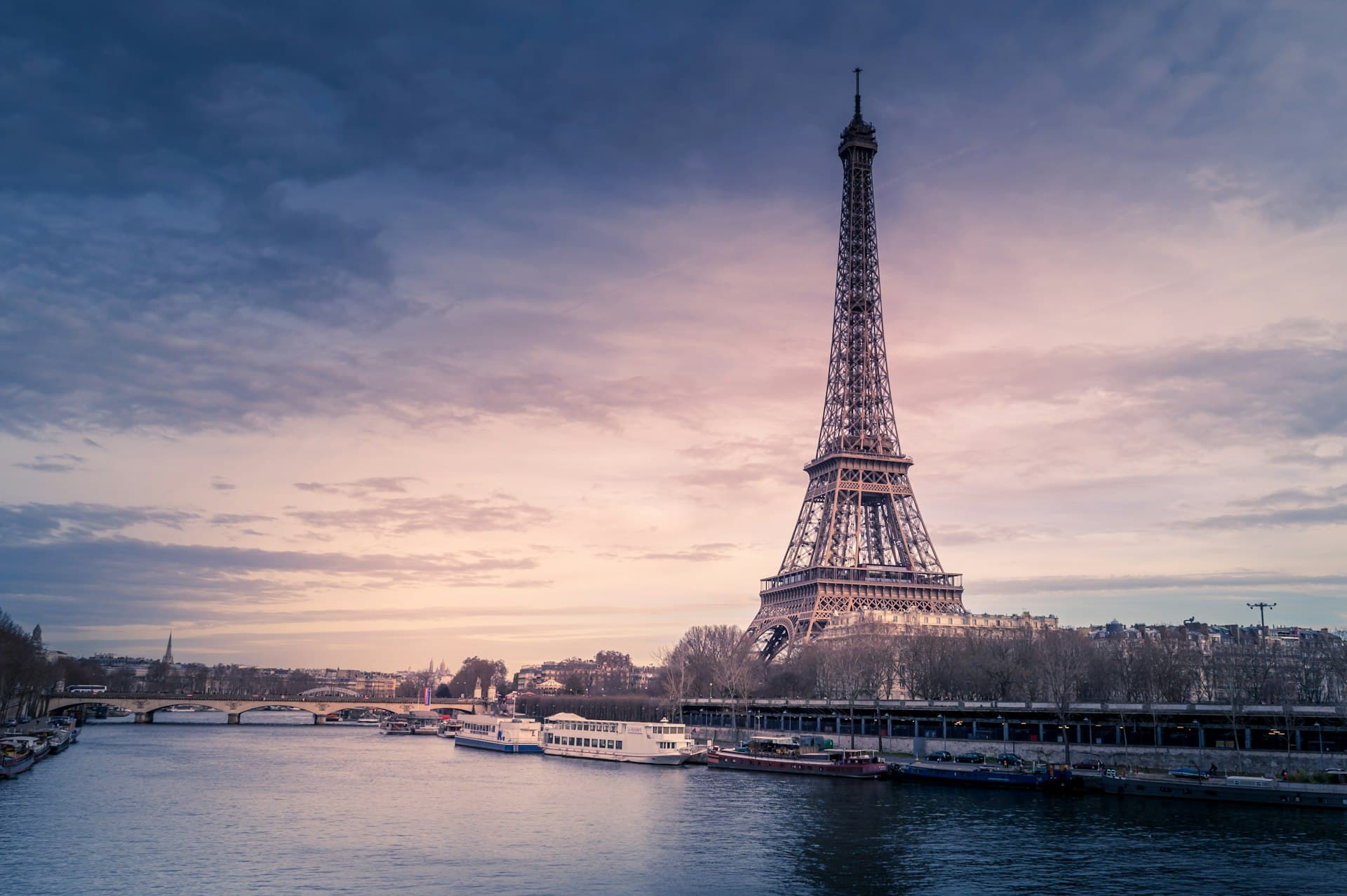 Eiffel Tower at sunset over the Seine river in Paris